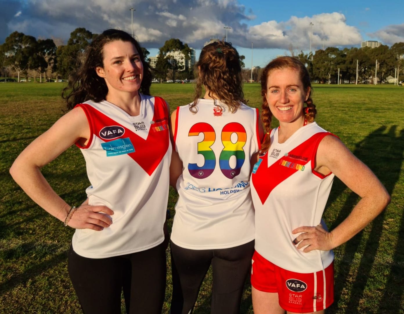Women of the SMDF Team posing with their new rainbow team shirts